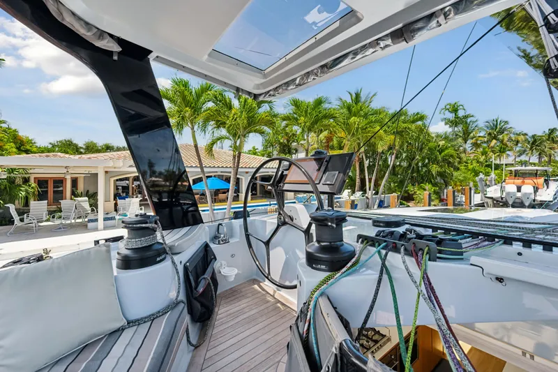 Slide: The Image of Cockpit of 2019 McConaghy MC60 yacht with tropical background and modern sailing equipment. - 34