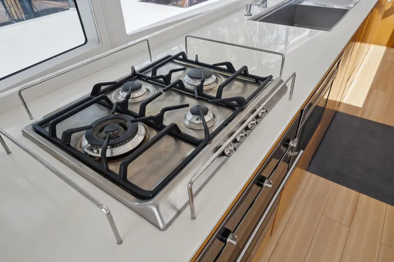 Slide: The Image of Modern kitchen with a four-burner gas stove on a McConaghy MC60 yacht, 2019 model. - 44