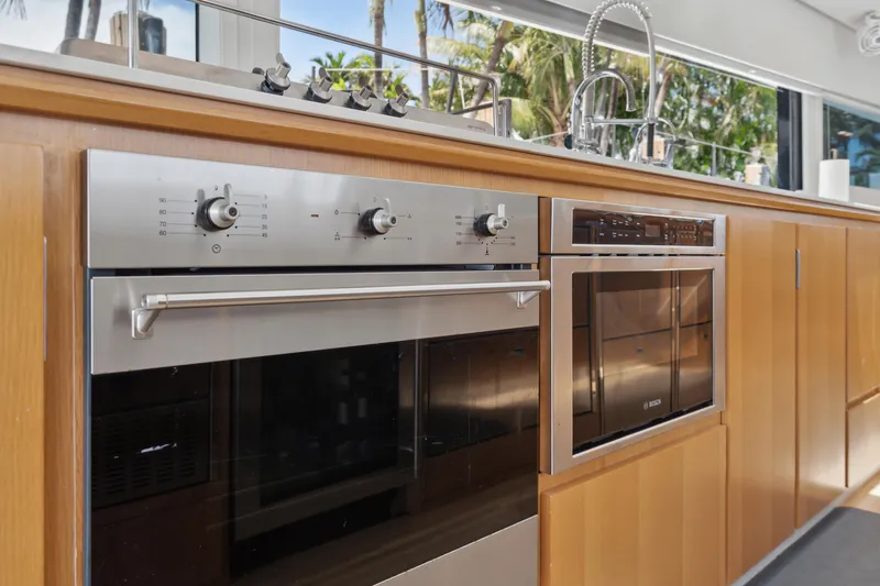 Slide: The Image of Modern kitchen appliances in a 2019 McConaghy MC60 yacht, featuring an oven and microwave. - 45
