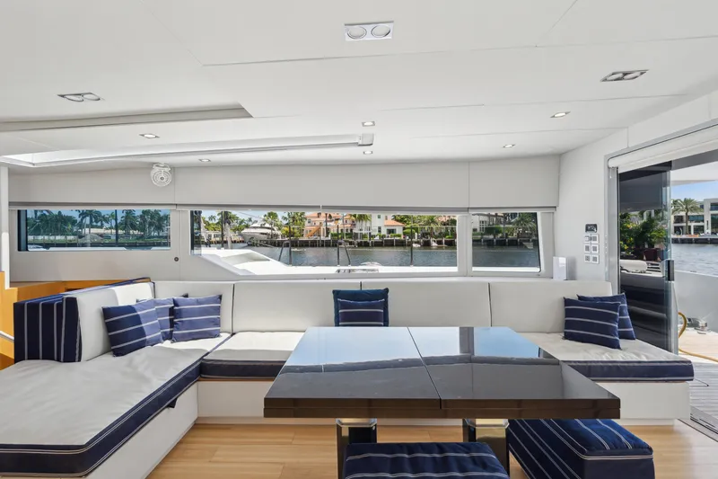 Slide: The Image of Luxurious interior of 2019 McConaghy MC60 yacht with modern seating and waterfront view. - 48