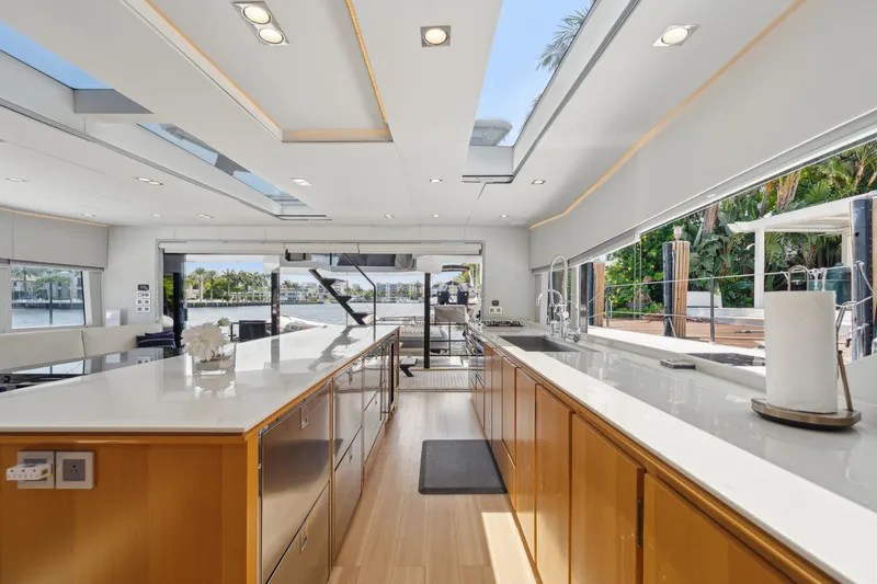 Slide: The Image of Luxurious interior of 2019 McConaghy MC60 yacht with modern kitchen and scenic views. - 49