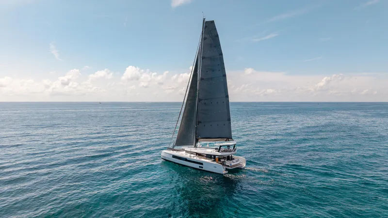 Slide: The Image of 2019 McConaghy MC60 sailing on open ocean under clear blue sky. - 9