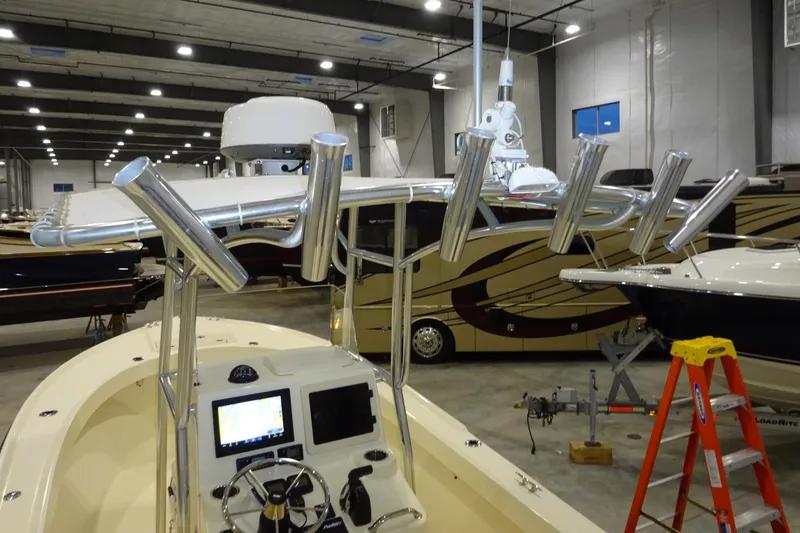 Slide: The Image of 2012 Parker 21 Special Edition boat in showroom with rod holders and navigation equipment. - 38
