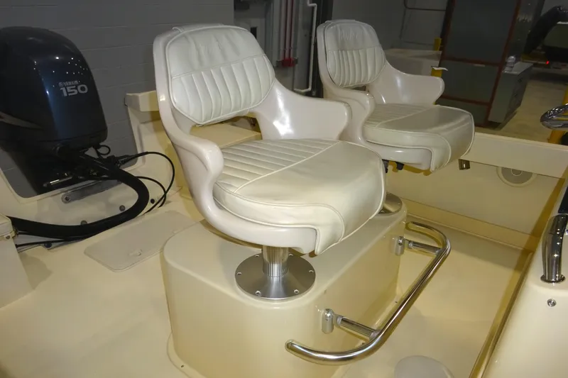 Slide: The Image of Two white cushioned boat seats on a 2012 Parker 21 Special Edition. - 41
