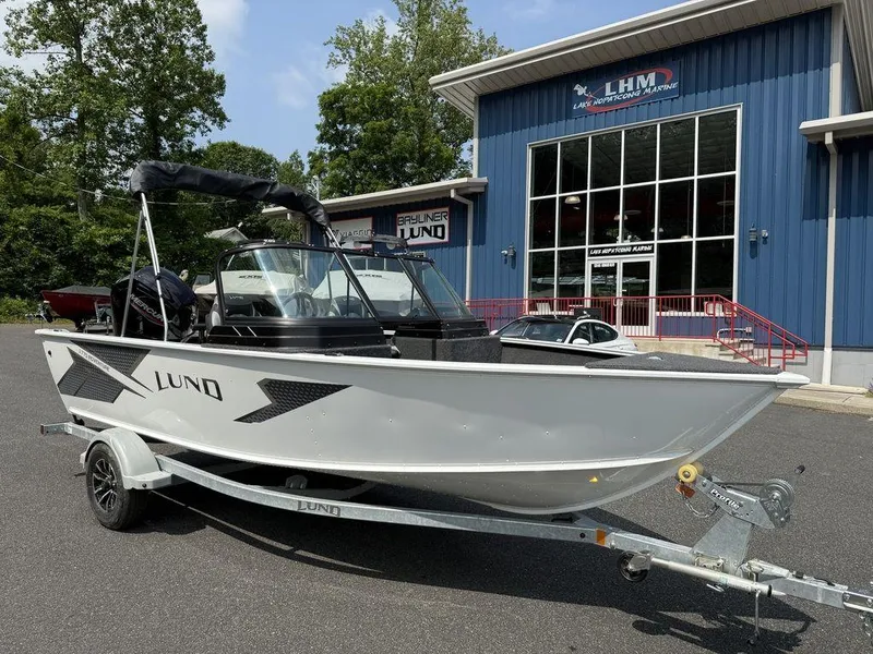 Slide: The Image of 2025 Lund 1775 Adventure Sport boat on trailer outside dealership. - 13