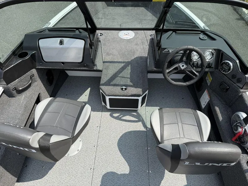 Slide: The Image of 2025 Lund 1775 Adventure Sport boat interior with dual seats and steering console. - 7