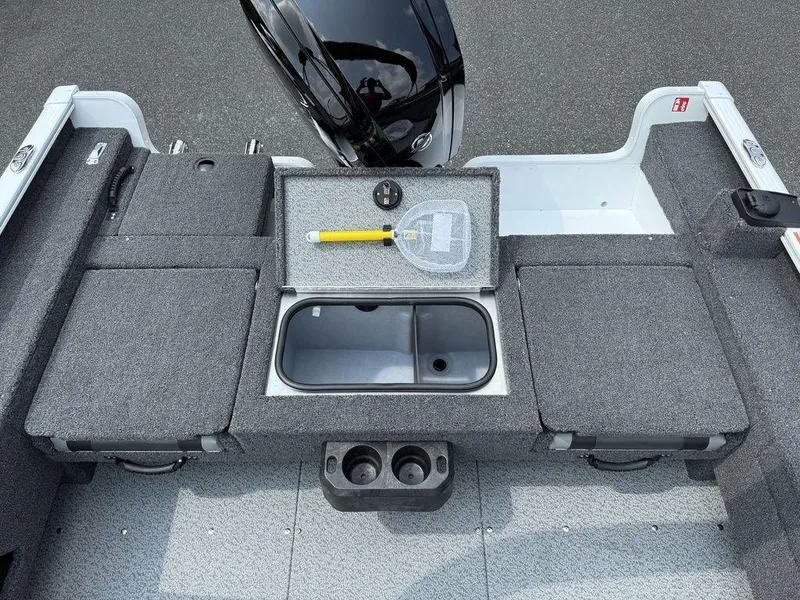 Slide: The Image of 2025 Lund 1775 Adventure Sport boat interior with storage compartments and fishing net. - 8