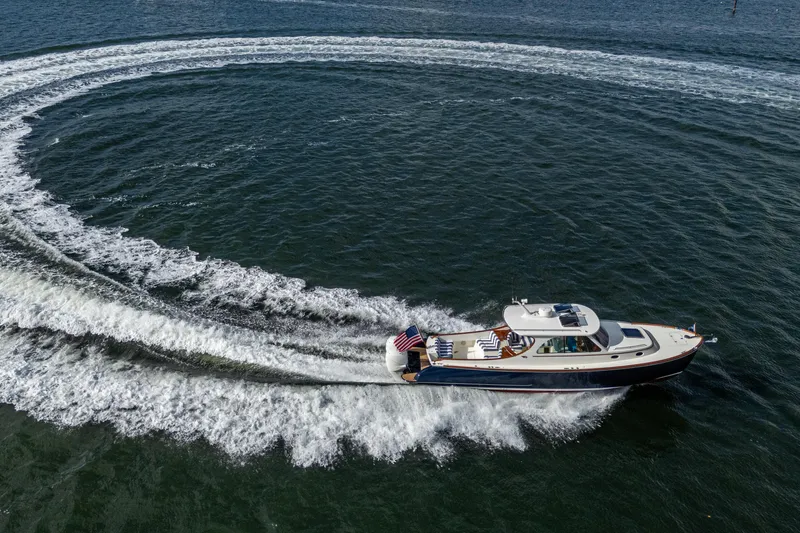 Slide: The Image of 2024 Hinckley 35 yacht making a circular wake on open water. - 29