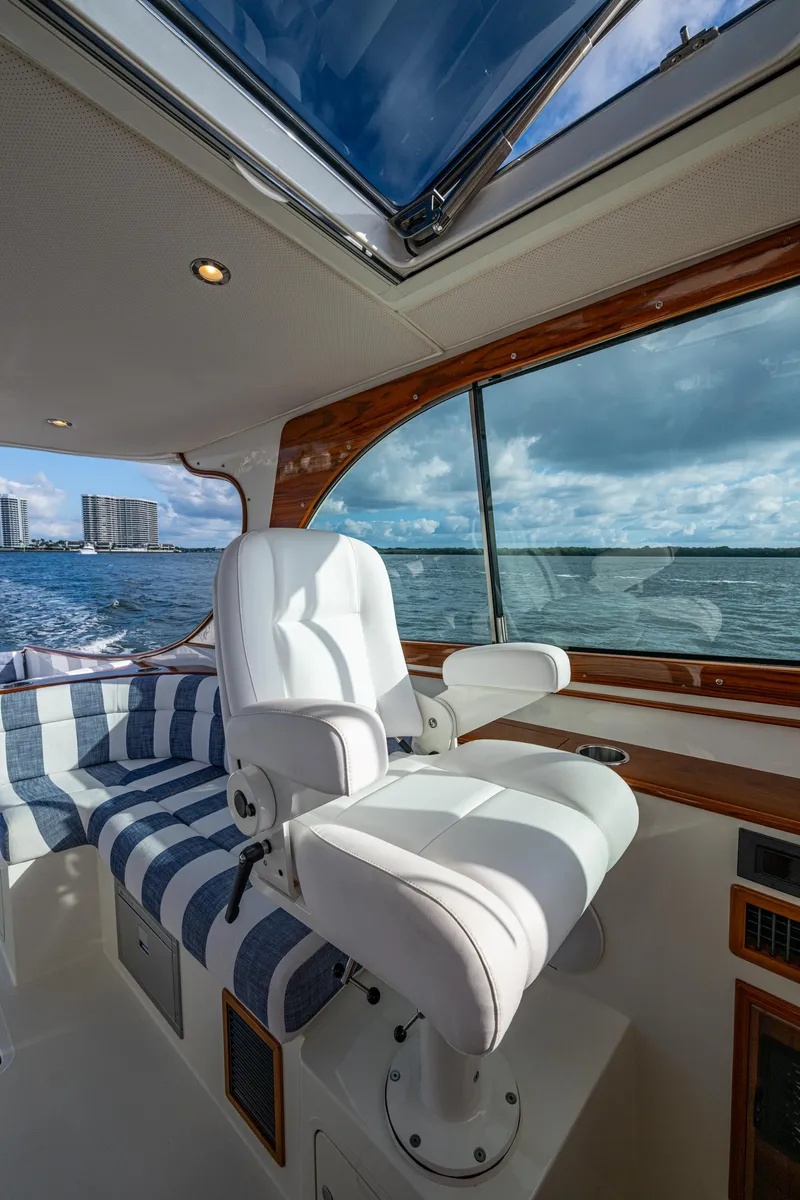 Slide: The Image of 2024 Hinckley 35 yacht interior with luxurious seating and ocean view. - 13