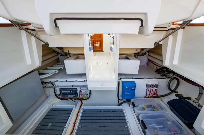 Slide: The Image of 2024 Hinckley 35 yacht interior, showcasing organized storage and electrical systems. - 28