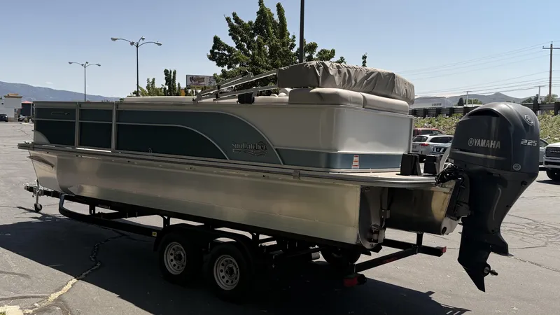 Slide: The Image of 2023 SunCatcher Select 322FC pontoon boat on trailer with Yamaha outboard motor. - 5