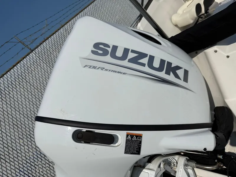 Slide: The Image of Suzuki four-stroke outboard motor on 2023 Stingray 191 DC boat. - 4