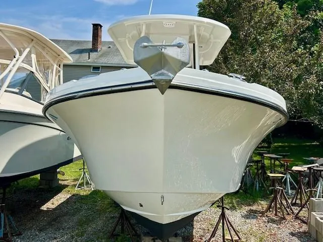 Slide: The Image of 2022 Parker 2200 Center Console boat docked at marina. - 2