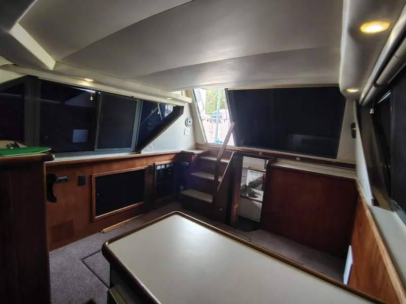 Slide: The Image of Interior of a 1994 Carver 300 boat, featuring wood paneling and modern design. - 30