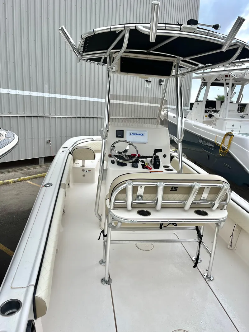 Slide: The Image of 2022 Carolina Skiff 23 Ultra Elite boat with T-top and center console. - 11