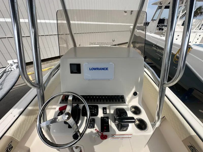 Slide: The Image of 2022 Carolina Skiff 23 Ultra Elite boat console with steering wheel and Lowrance system. - 13