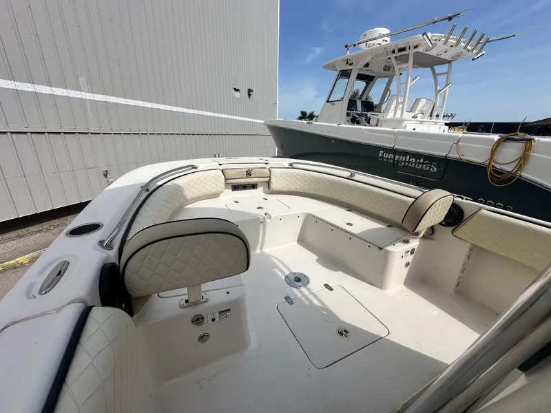 Slide: The Image of 2022 Carolina Skiff 23 Ultra Elite boat with spacious seating and modern design. - 20