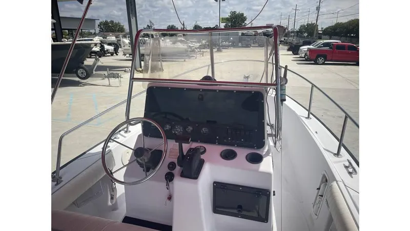 Slide: The Image of 1997 Boston Whaler OUTRAGE boat dashboard with steering wheel and controls. - 8