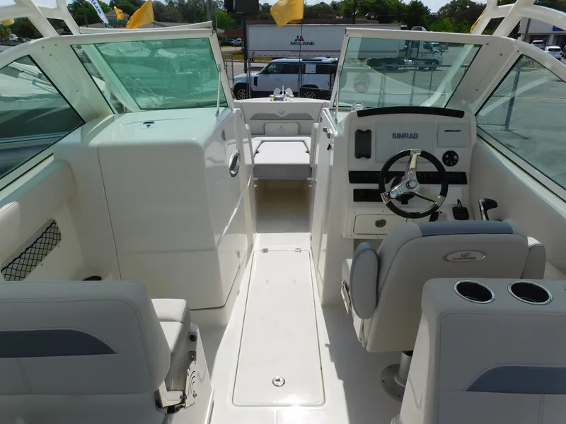 Slide: The Image of 2025 Sailfish 245 DC boat interior with dual consoles and modern steering. - 23