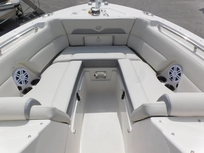 Slide: The Image of 2025 Sailfish 245 DC boat interior with white seating and speakers. - 4