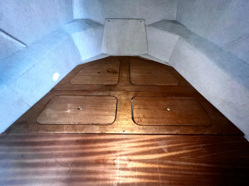 Slide: The Image of Interior of ACB 30 boat, 2003 model, featuring wooden storage compartments. - 27