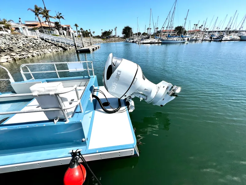 Slide: The Image of Boat with Suzuki outboard motor docked in marina, ACB 30 model, 2003. - 8