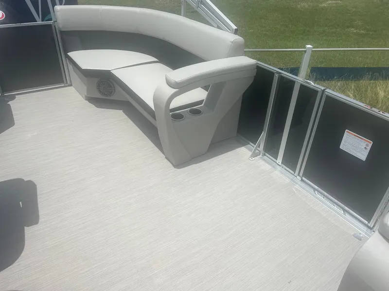 Slide: The Image of 2024 Harris FloteBote 210 Breeze pontoon interior with cushioned seating and cup holders. - 14