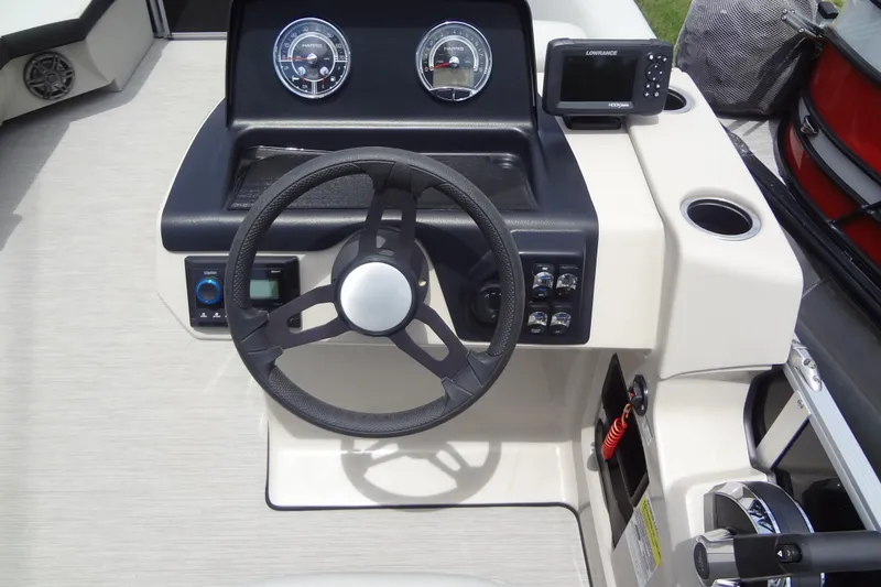 Slide: The Image of 2024 Harris FloteBote 210 Breeze dashboard with steering wheel and control panel. - 17