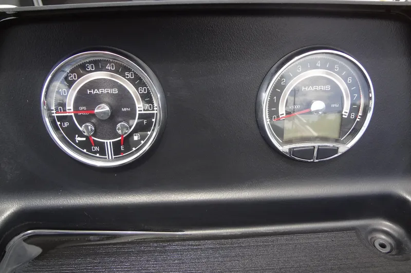 Slide: The Image of Dashboard gauges of 2024 Harris FloteBote 210 Breeze, displaying speed and RPM. - 18