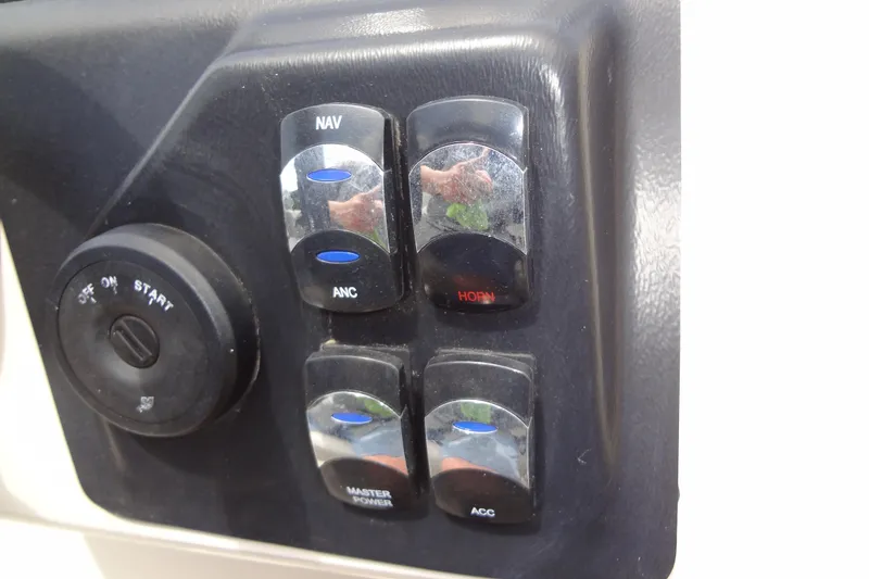 Slide: The Image of Control panel of 2024 Harris FloteBote 210 Breeze with switches and ignition. - 20