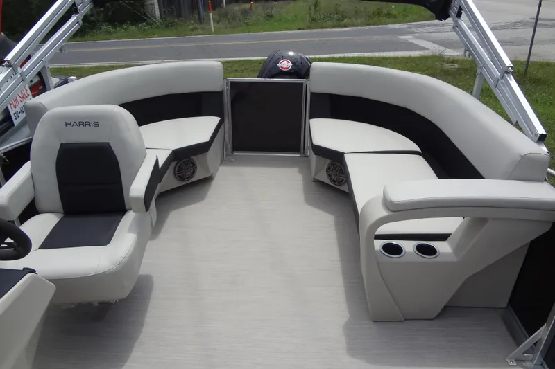 Slide: The Image of 2024 Harris FloteBote 210 Breeze pontoon boat interior with plush seating and cup holders. - 23