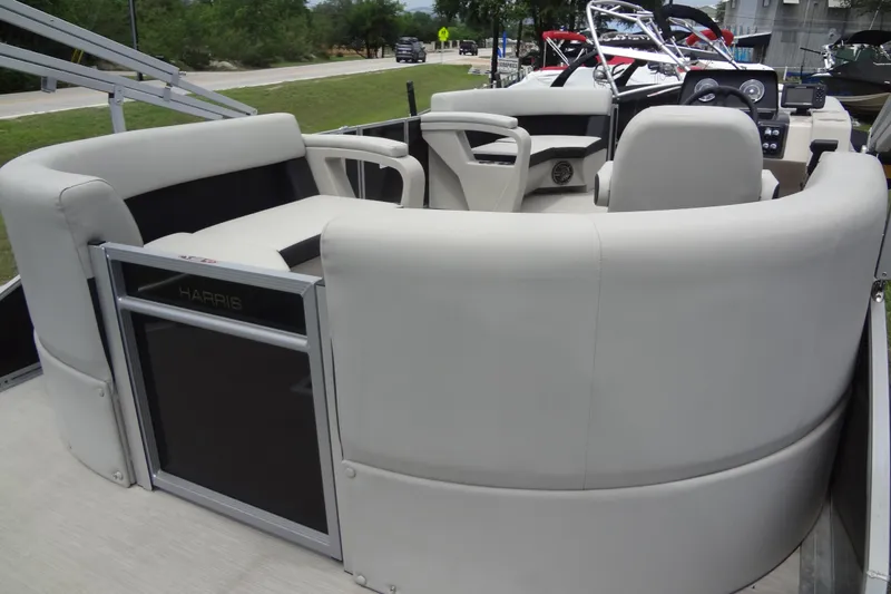 Slide: The Image of 2024 Harris FloteBote 210 Breeze pontoon boat interior with plush seating and modern design. - 25