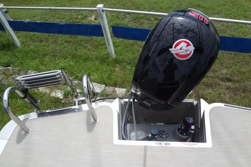 Slide: The Image of 2024 Harris FloteBote 210 Breeze boat with outboard motor and swim ladder. - 27