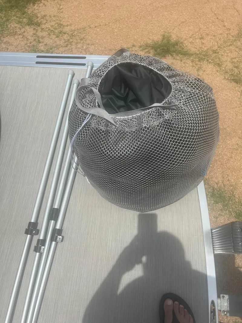 Slide: The Image of Mesh bag on 2024 Harris FloteBote 210 Breeze pontoon deck. - 9