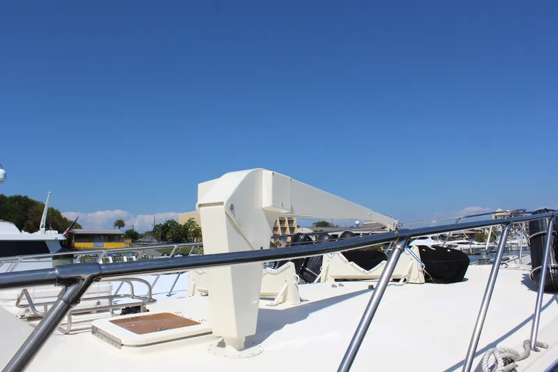Slide: The Image of 1987 Hatteras 65 Convertible yacht deck with clear blue sky background. - 19