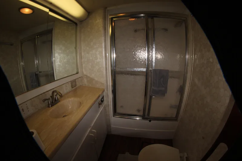 Slide: The Image of Bathroom interior of 1987 Hatteras 65 Convertible yacht with shower and vanity. - 47