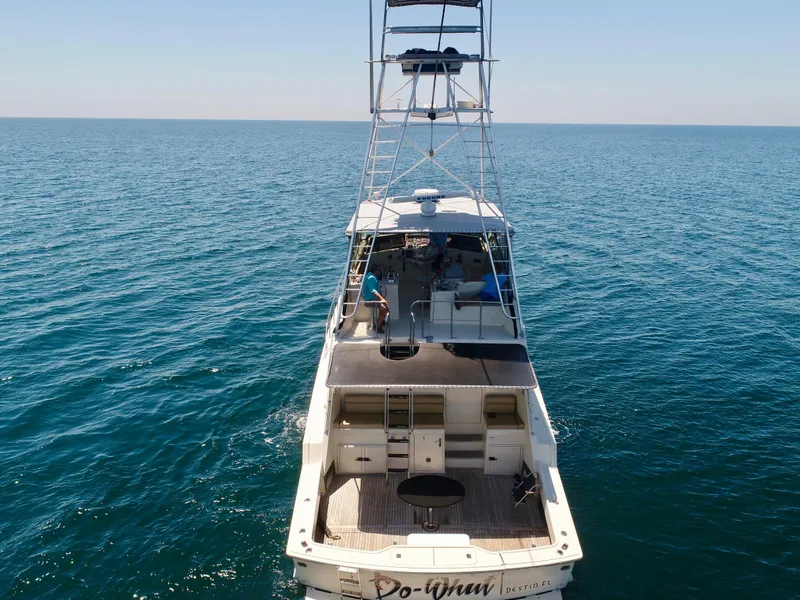 Slide: The Image of 1987 Hatteras 65 Convertible yacht on open sea, aerial view. - 5