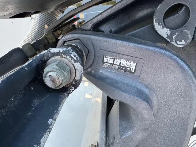 Slide: The Image of Close-up of a 1995 Pro-Line 231 WA boat component with visible serial number and bolt. - 19