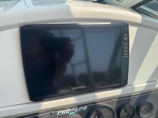Slide: The Image of Garmin display on 1995 Pro-Line 231 WA boat dashboard. - 9
