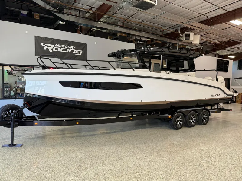 The Image of 2025 Navan C30 boat on trailer in showroom, featuring sleek design and modern features. - 0