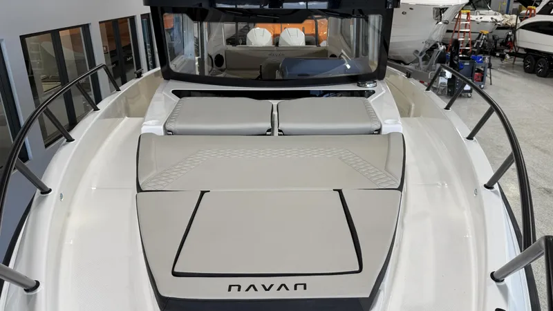 Slide: The Image of 2025 Navan C30 boat with sleek design and spacious deck in showroom. - 13