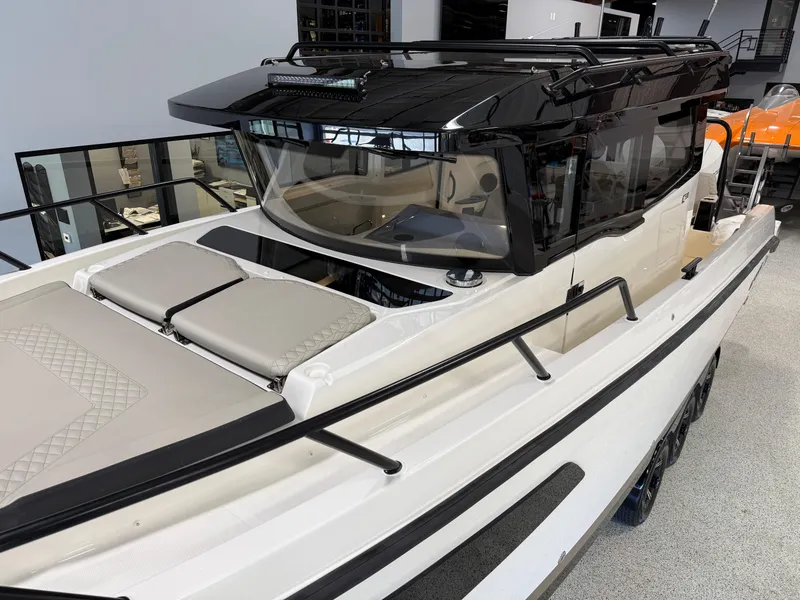 Slide: The Image of 2025 Navan C30 boat with sleek design, black cabin, and spacious deck. - 15