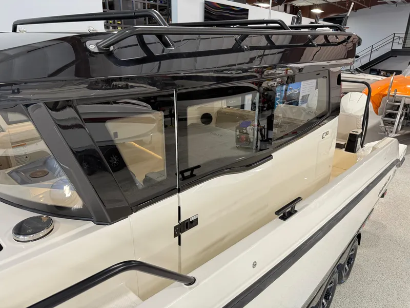 Slide: The Image of 2025 Navan C30 boat with sleek design and modern features in showroom. - 17