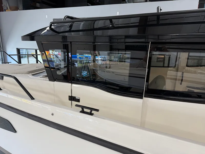 Slide: The Image of 2025 Navan C30 boat with sleek black and white design, modern windows, and stylish exterior. - 19