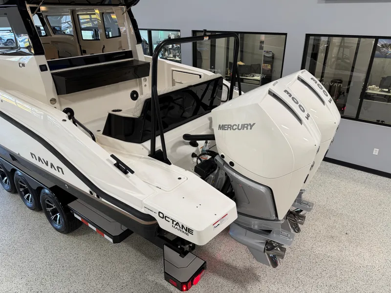 Slide: The Image of Navan C30 2025 boat with dual Mercury outboard engines in showroom. - 23