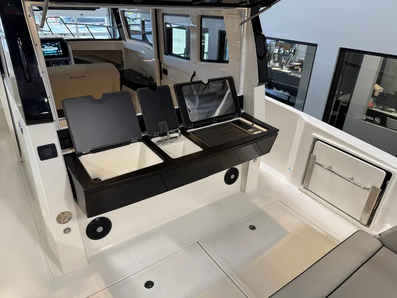 Slide: The Image of Modern Navan C30 boat interior with sleek kitchen amenities, 2025 model. - 26