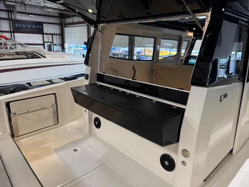 Slide: The Image of Navan C30 2025 boat interior showcasing sleek design and modern amenities in a showroom setting. - 27
