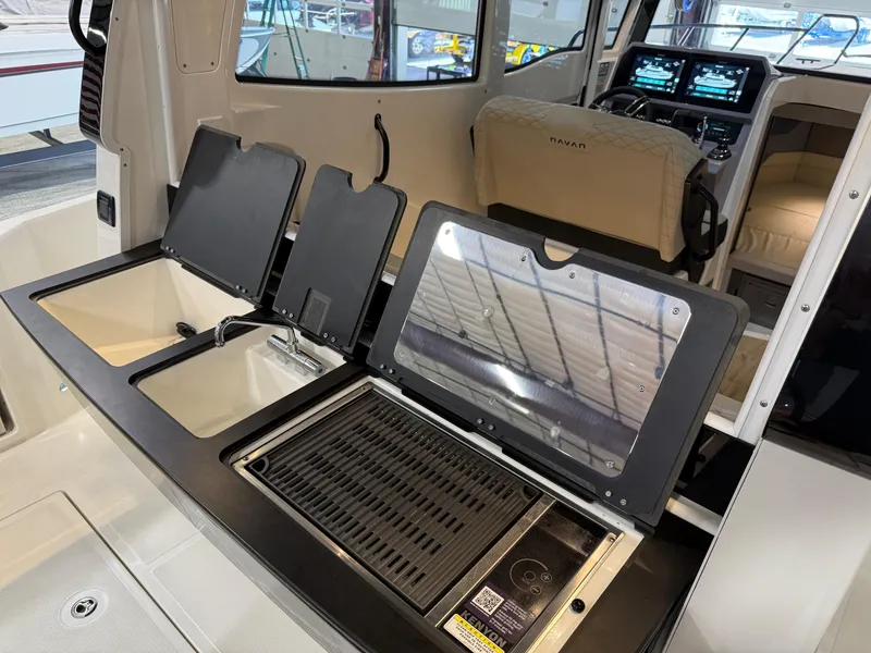 Slide: The Image of Navan C30 2025 boat interior with modern kitchen and navigation controls. - 28