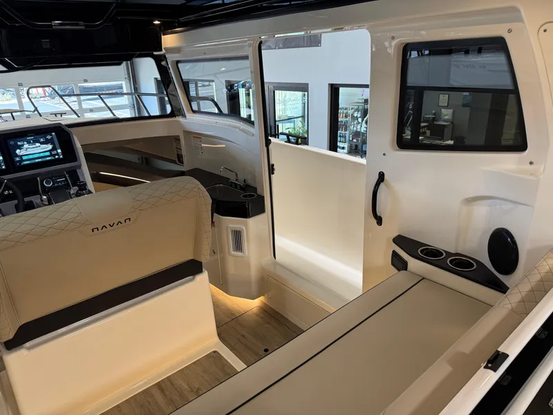 Slide: The Image of Interior of 2025 Navan C30 boat with modern seating and control panel. - 31
