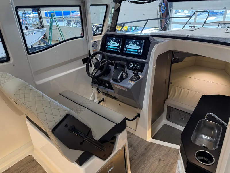 Slide: The Image of Interior of 2025 Navan C30 boat with modern cockpit and seating area. - 33